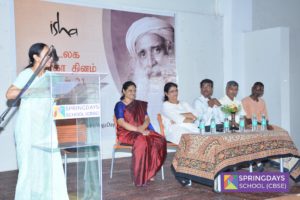 Teacher addressing students regarding the importance of Yoga